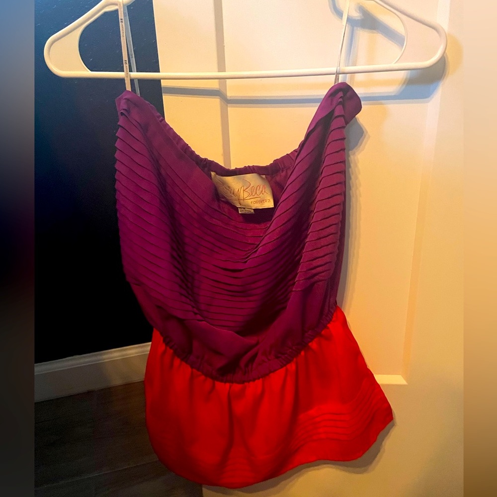 Magenta purple and bright red strapless top.